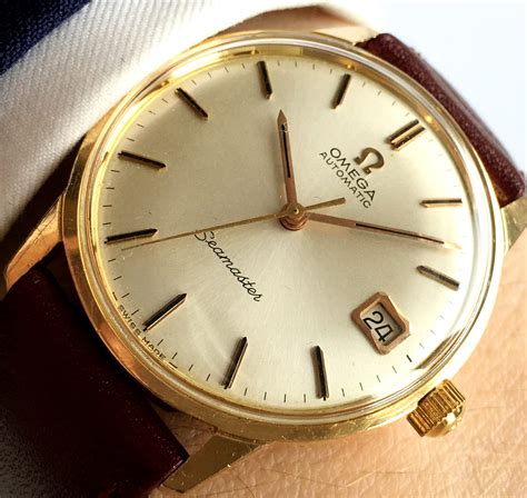 omega 18k gold watch vintage.